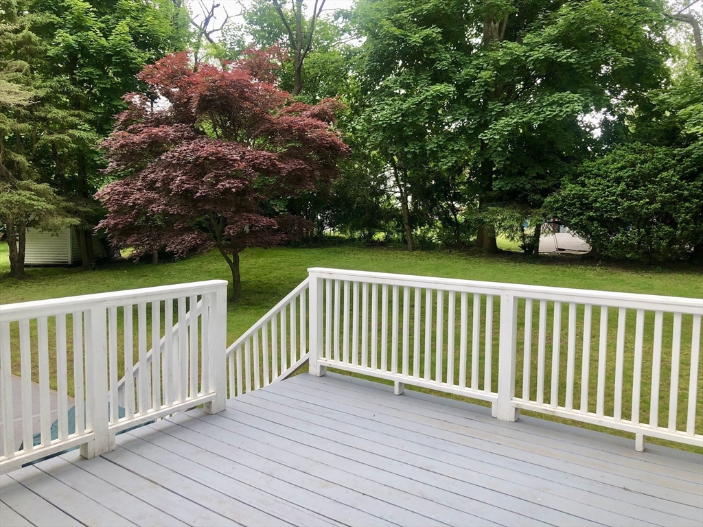 15 Sycamore Road Wakefield, MA 01880 - Photo 32 of 39 a view of balcony with wooden floor and fence