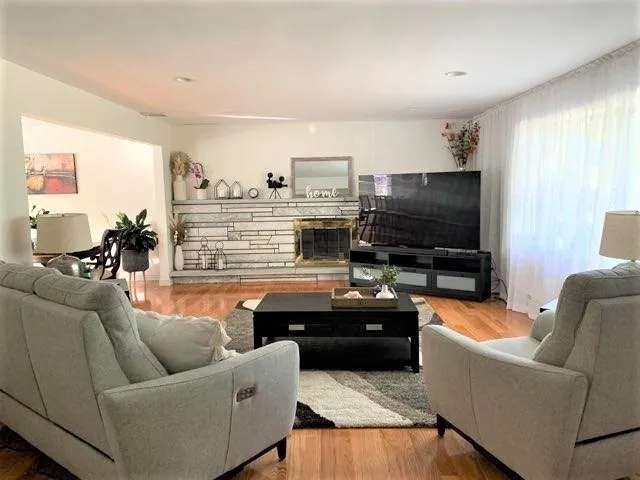 a living room with furniture and a flat screen tv