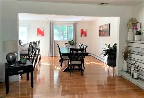 a dining room with furniture and window