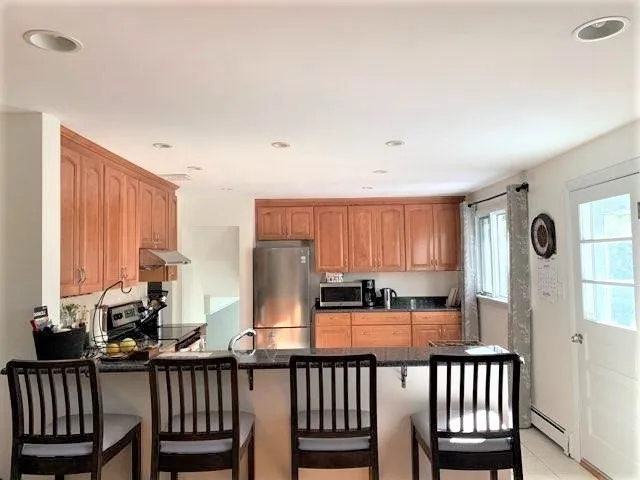 a view of a living room with furniture and a window