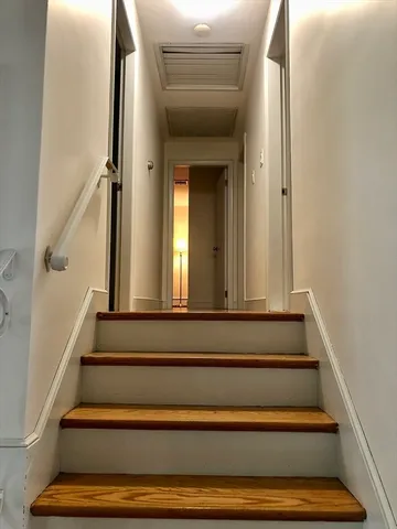 a view of staircase with white walls