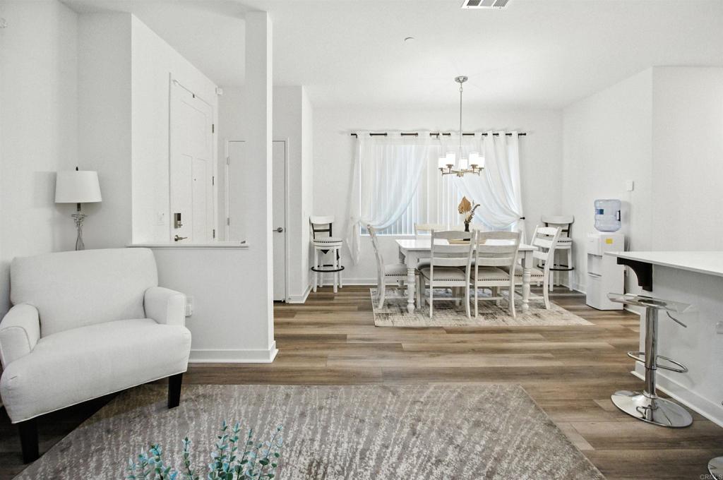 332 Seedling Way Fallbrook, CA 92028 - Photo 11 of 37 a living room with furniture and a chandelier