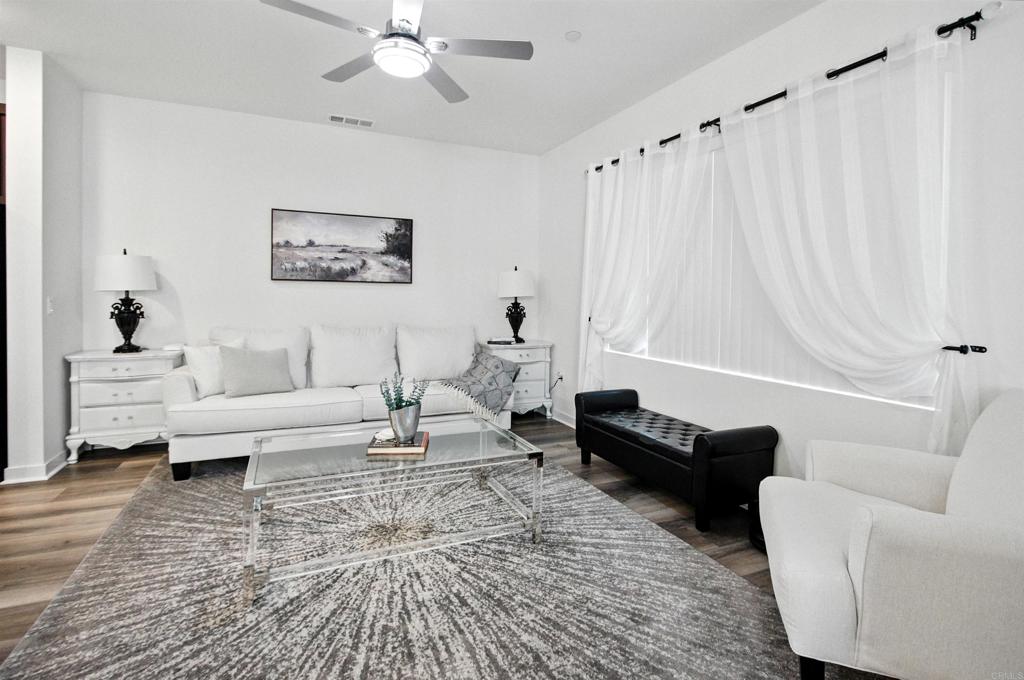 332 Seedling Way Fallbrook, CA 92028 - Photo 13 of 37 a living room with furniture and a rug