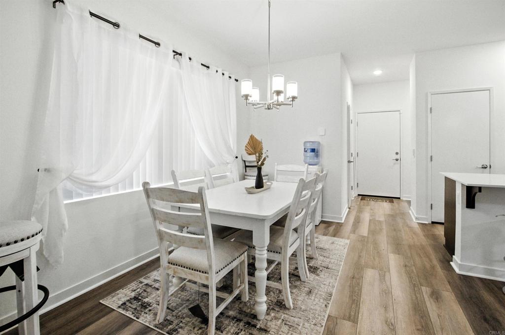 332 Seedling Way Fallbrook, CA 92028 - Photo 15 of 37 a view of a workspace with furniture and wooden floor