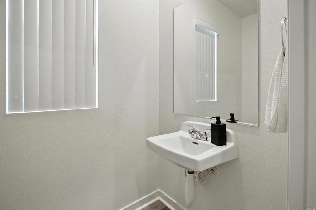 332 Seedling Way Fallbrook, CA 92028 - Photo 16 of 37 a bathroom with a sink and a mirror