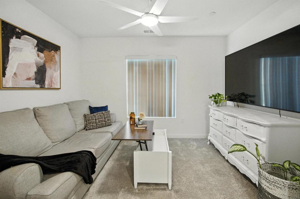 332 Seedling Way Fallbrook, CA 92028 - Photo 19 of 37 a living room with furniture and a flat screen tv