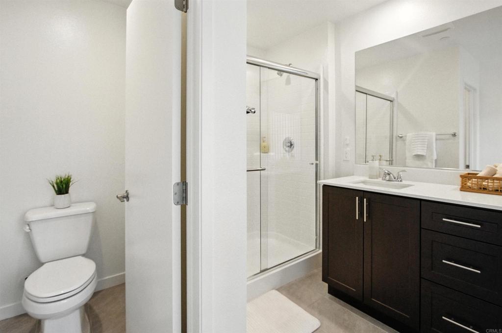 332 Seedling Way Fallbrook, CA 92028 - Photo 23 of 37 a bathroom with a sink a toilet and shower