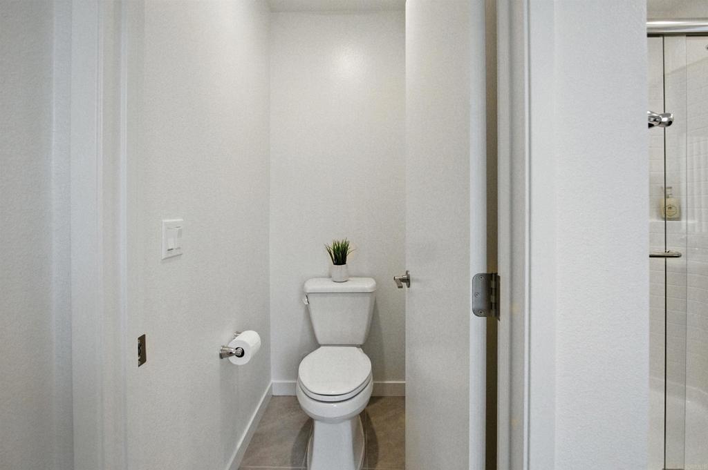 332 Seedling Way Fallbrook, CA 92028 - Photo 24 of 37 a bathroom with a toilet and a sink