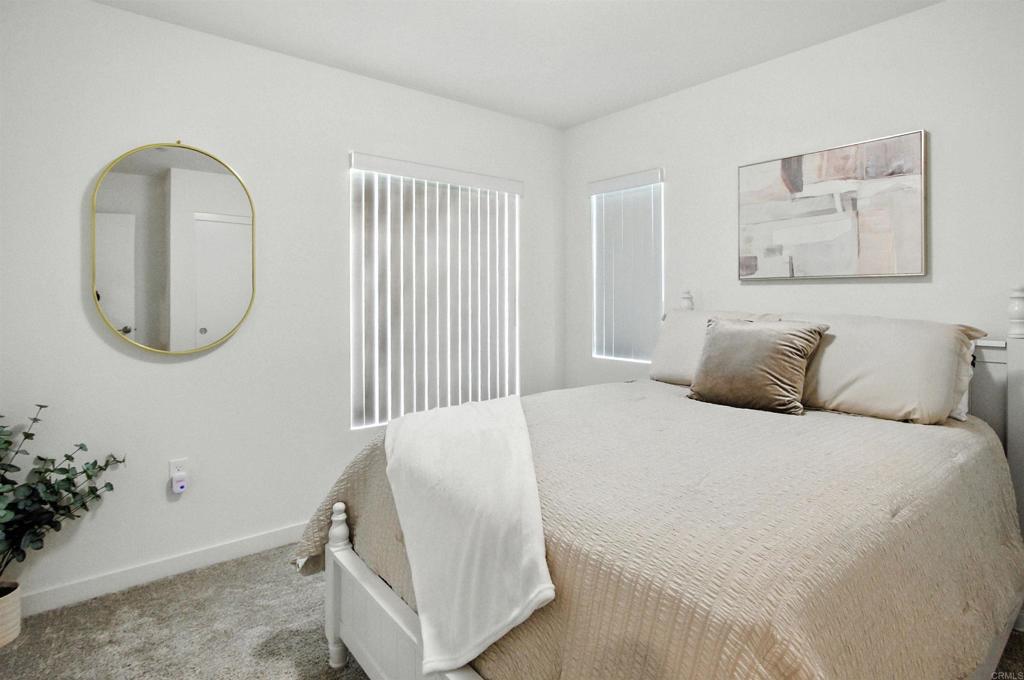 332 Seedling Way Fallbrook, CA 92028 - Photo 28 of 37 a bedroom with a bed and a mirror