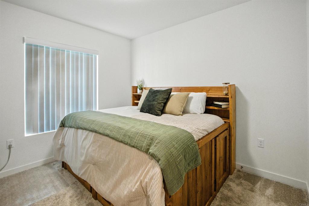 332 Seedling Way Fallbrook, CA 92028 - Photo 29 of 37 a bedroom with a bed and window