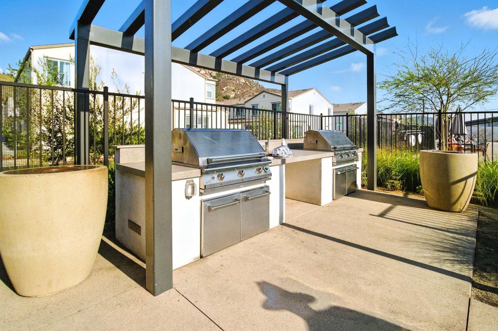 332 Seedling Way Fallbrook, CA 92028 - Photo 33 of 37 a kitchen with a table and chairs