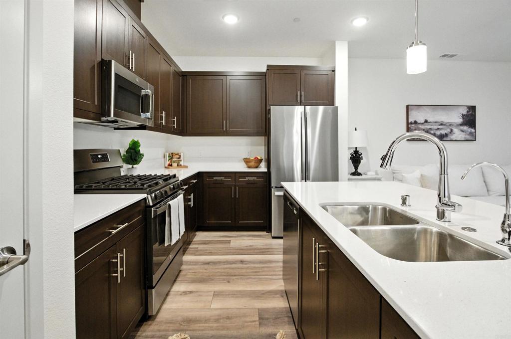 332 Seedling Way Fallbrook, CA 92028 - Photo 5 of 37 a kitchen with a sink stove and refrigerator