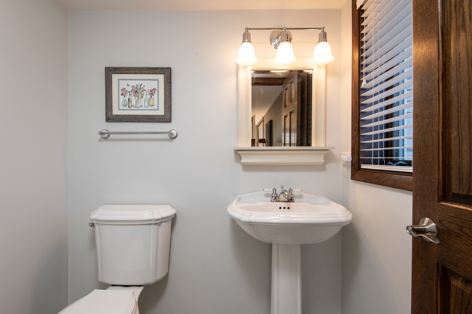 13530 South Monaghan Road Homer Glen, IL 60491 - Photo 31 of 45 a bathroom with a toilet sink and mirror