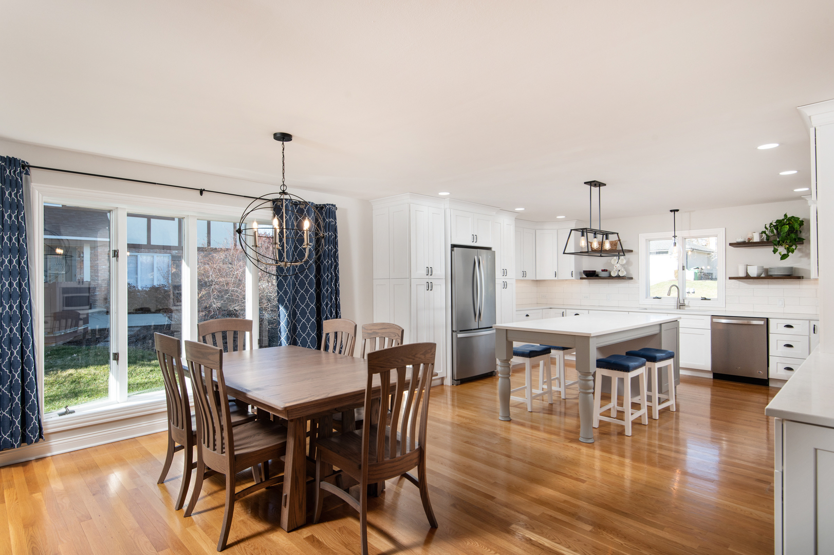 13530 South Monaghan Road Homer Glen, IL 60491 - Photo 10 of 45 a dining area with stainless steel appliances kitchen island granite countertop a dining table chairs and granite counter tops