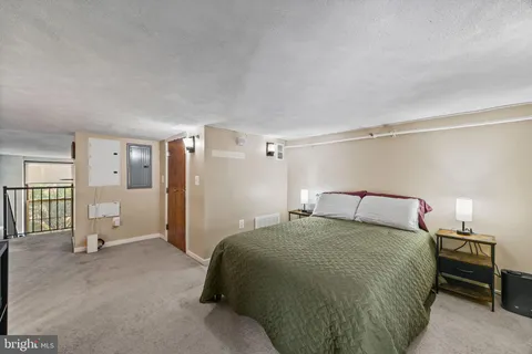 a bedroom with a bed and a cabinets