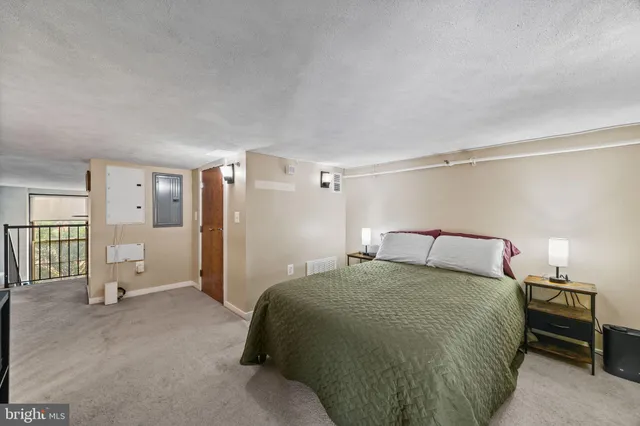 a bedroom with a bed and a cabinets