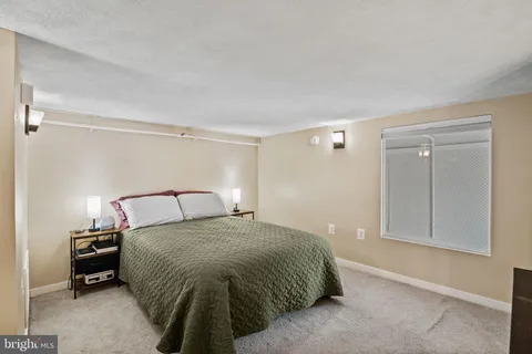 a bedroom with a bed and a cabinets