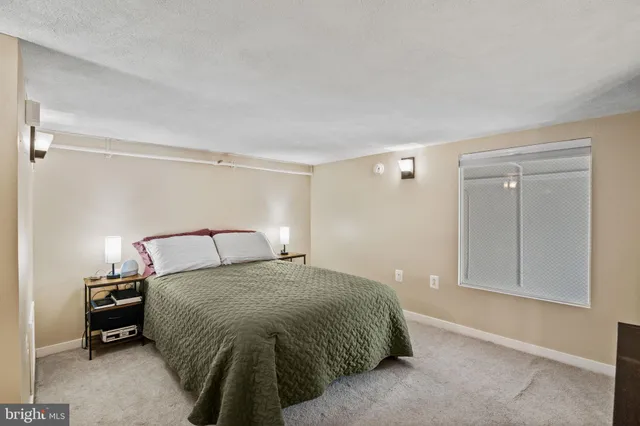 a bedroom with a bed and a cabinets