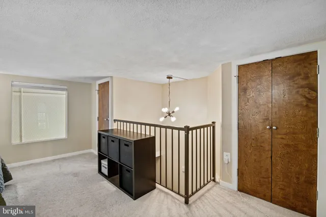 a view of a hallway with entryway door front door