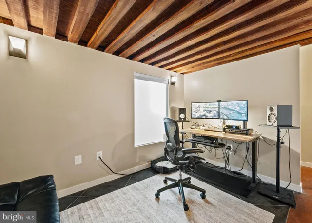 a view of a workspace with furniture