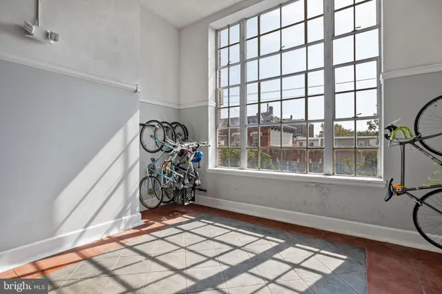 a kitchen with a sink a stove a window and stainless steel appliances