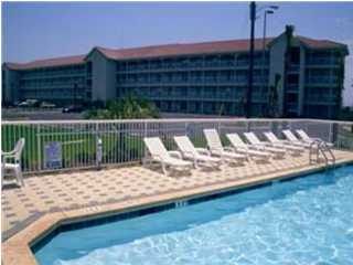 a view of swimming pool with a lounge chair