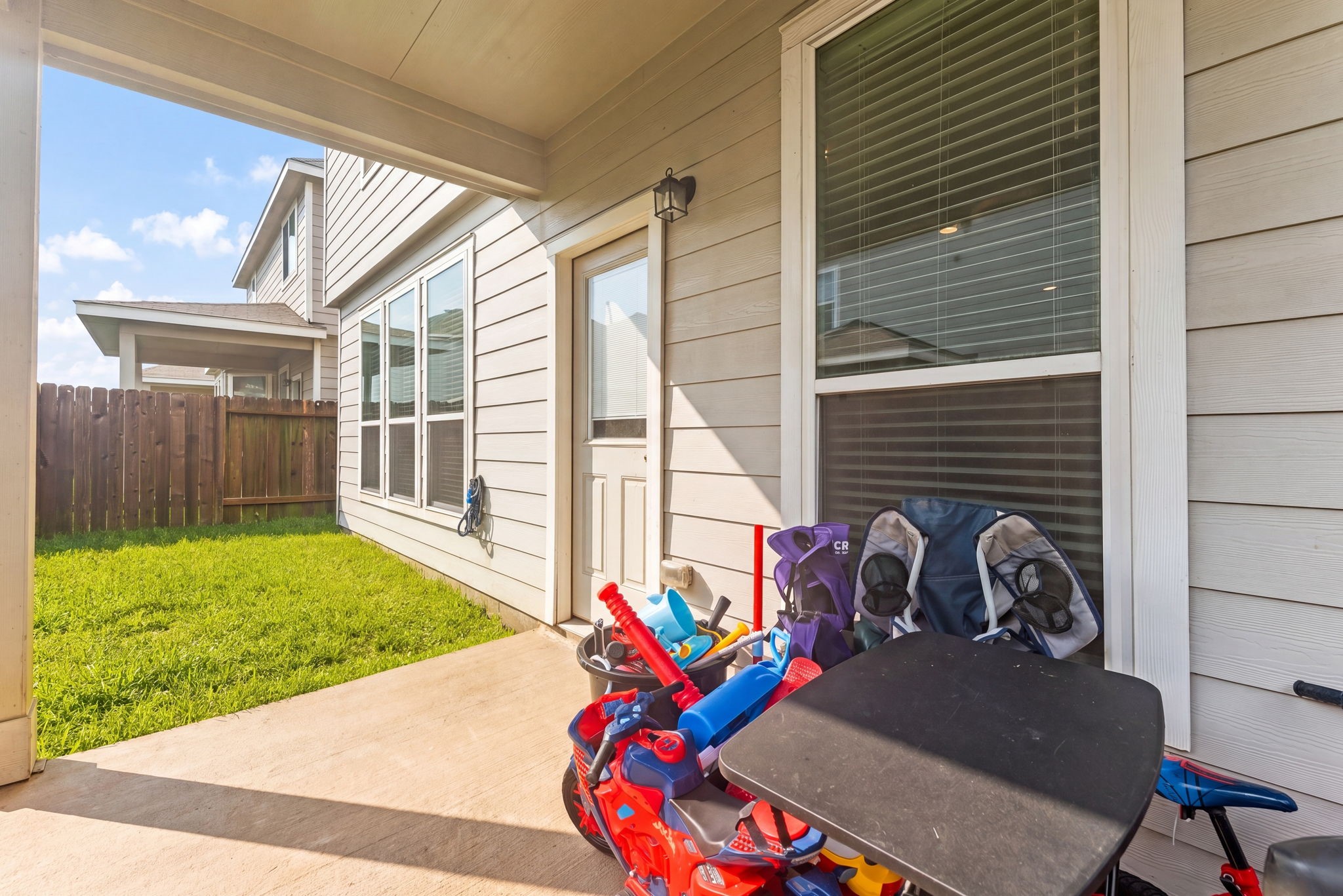 22210 Imperious Parkway Houston, TX 77073 - Photo 19 of 23 a view of a porch with furniture and floor to ceiling window