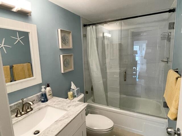 500 Ocean Trail Way, Unit 204 Jupiter, FL 33477 - Photo 15 of 39 a bathroom with a granite countertop sink toilet and shower