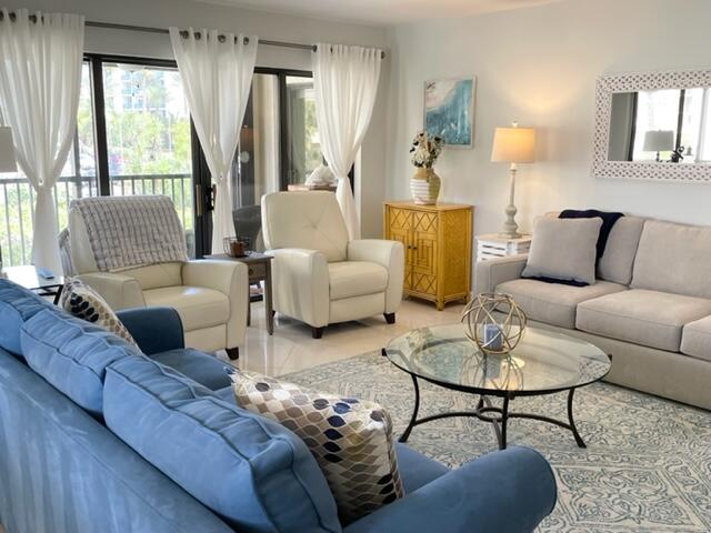 500 Ocean Trail Way, Unit 204 Jupiter, FL 33477 - Photo 7 of 39 a living room with furniture and a large window
