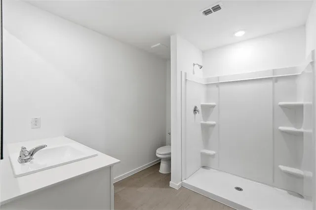 a bathroom with a sink a toilet and a bathtub