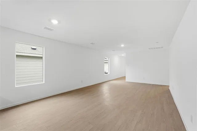 an empty room with a empty space and window