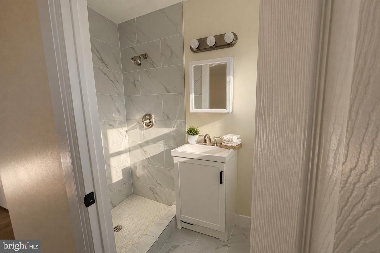 306 Cambridge Road Cherry Hill, NJ 08034 - Photo 4 of 13 a bathroom with a sink toilet and shower