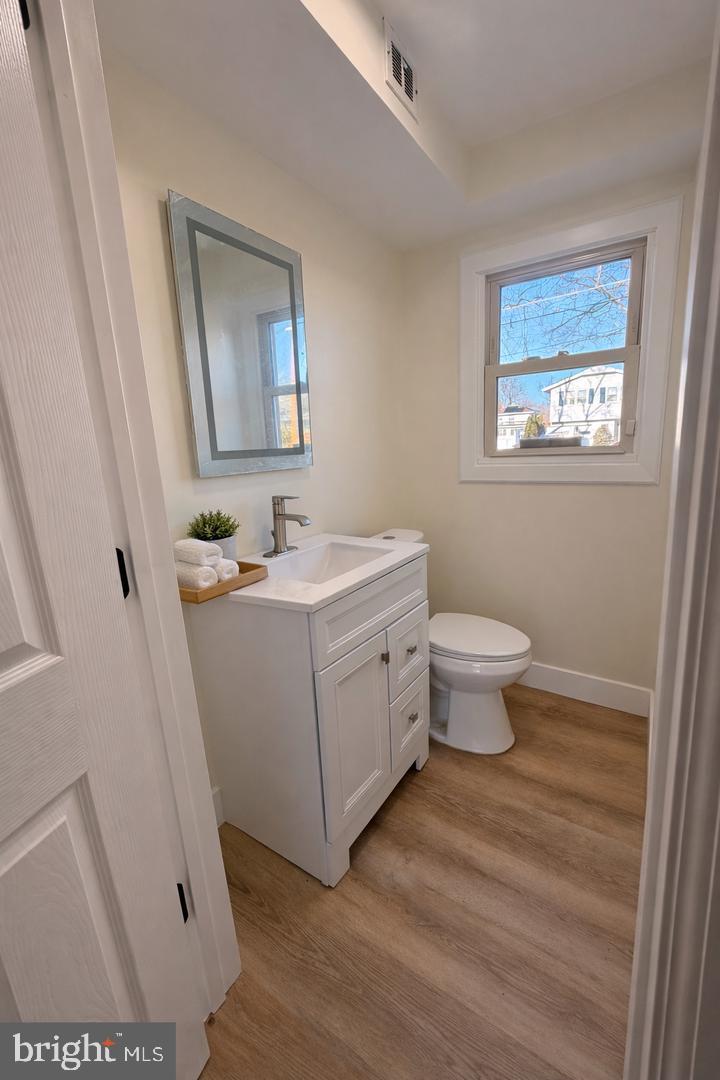 306 Cambridge Road Cherry Hill, NJ 08034 - Photo 6 of 13 a bathroom with a sink mirror vanity and toilet