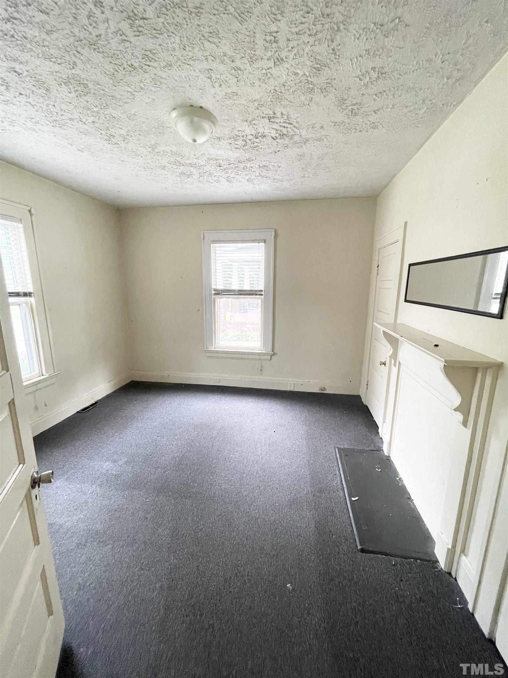 1005 Anderson Street Northwest Wilson, NC 27893 - Photo 13 of 16 an empty room with windows