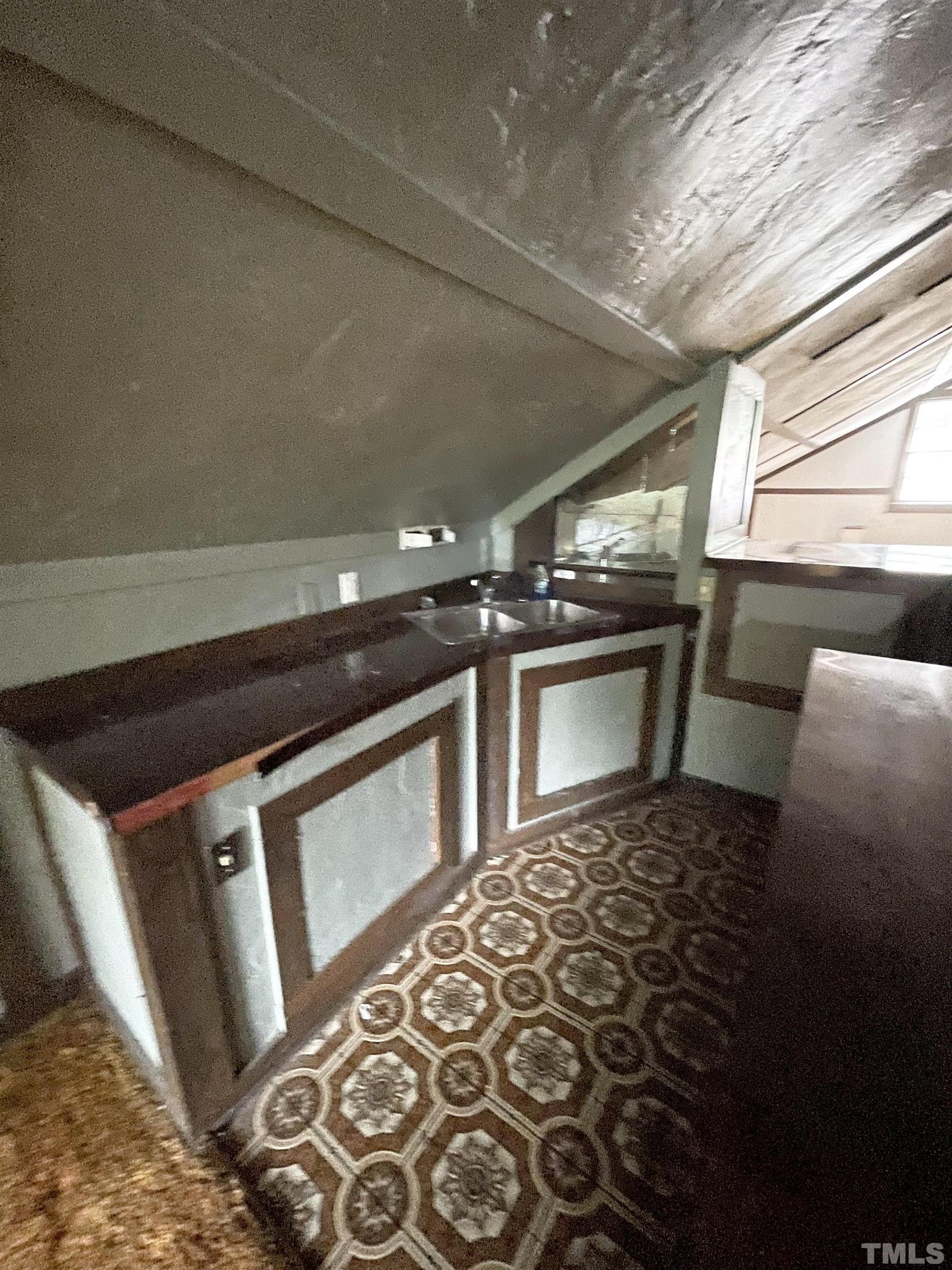 1005 Anderson Street Northwest Wilson, NC 27893 - Photo 16 of 16 a view of an empty room with a fireplace
