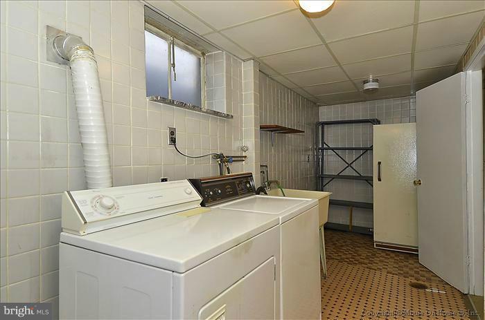 1005 Forest Glen Road Silver Spring, MD 20901 - Photo 1 of 26 a utility room with dryer and washer