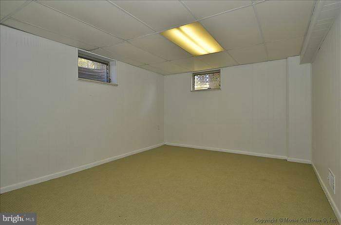 1005 Forest Glen Road Silver Spring, MD 20901 - Photo 16 of 26 an empty room with a empty space and a window