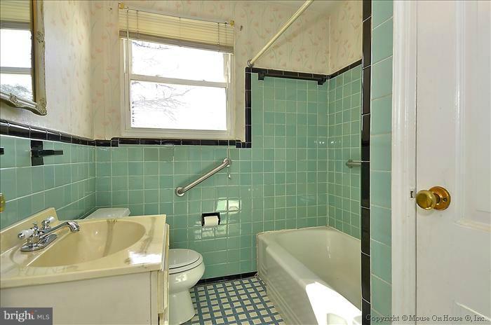 1005 Forest Glen Road Silver Spring, MD 20901 - Photo 20 of 26 a bathroom with a sink toilet and shower