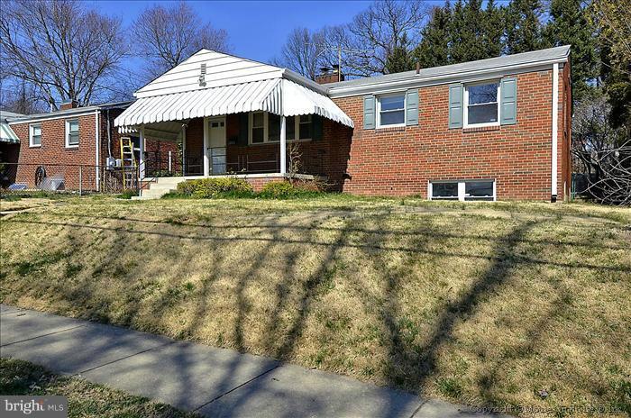 1005 Forest Glen Road Silver Spring, MD 20901 - Photo 3 of 26 a front view of a house with a garden