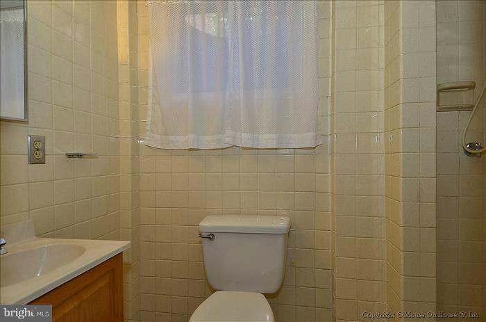 1005 Forest Glen Road Silver Spring, MD 20901 - Photo 21 of 26 a bathroom with a toilet and a sink
