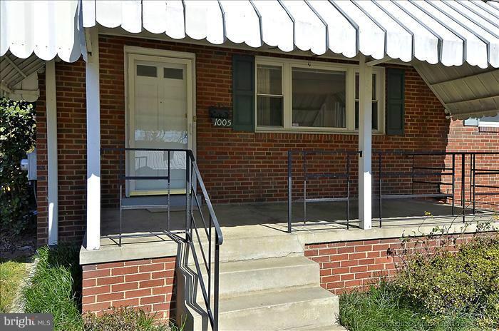 1005 Forest Glen Road Silver Spring, MD 20901 - Photo 22 of 26 a side view of a house with a door