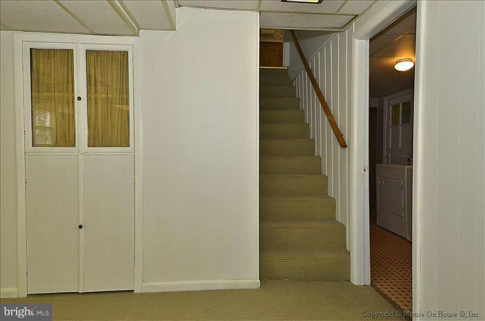 1005 Forest Glen Road Silver Spring, MD 20901 - Photo 25 of 26 a view of a hallway with wooden floor and entryway