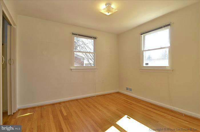 1005 Forest Glen Road Silver Spring, MD 20901 - Photo 4 of 26 an empty room with a window