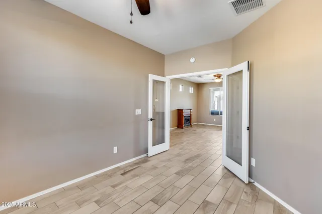 a kitchen with stainless steel appliances granite countertop a refrigerator a sink and a stove