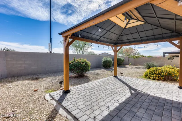 a view of a field with a building in the background