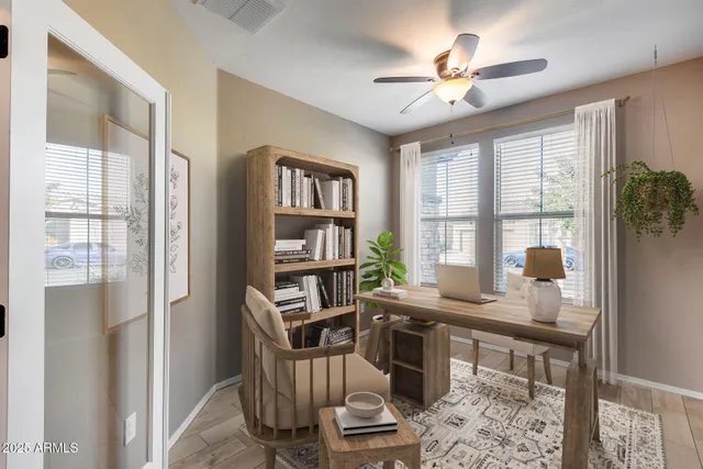 a workspace with furniture and a window