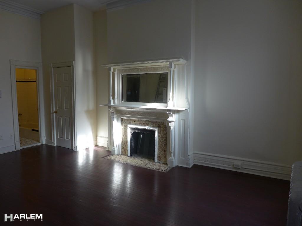 30 Edgecombe Avenue Manhattan, NY 10030 - Photo 6 of 16 a view of a livingroom with wooden floor and a fireplace