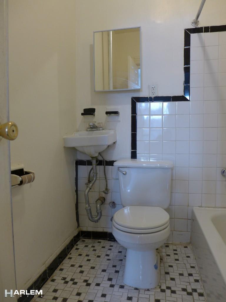 30 Edgecombe Avenue Manhattan, NY 10030 - Photo 7 of 16 a bathroom with a toilet and a sink