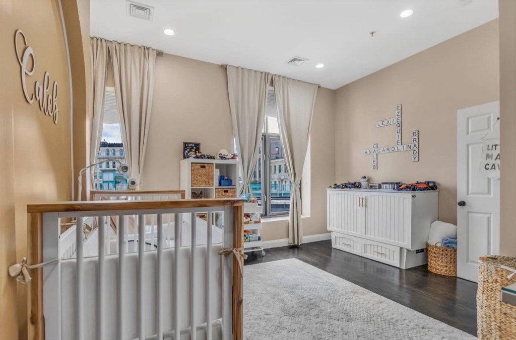 7 Central Square, Unit 307 Lynn, MA 01901 - Photo 7 of 9 a view of a hallway with furniture and windows