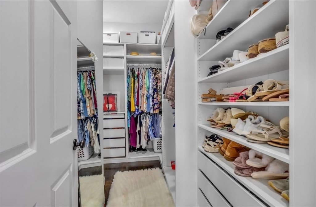 7 Central Square, Unit 307 Lynn, MA 01901 - Photo 9 of 9 a view of walk in closet with clothes and shoes